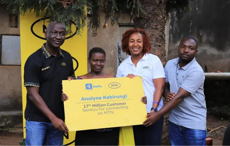 17th Million subscriber with MTN Uganda Chief Executive Officer, Sylvia Mulinge and the MTN Uganda Sales and Distribution General Manager, Joseph Bogera