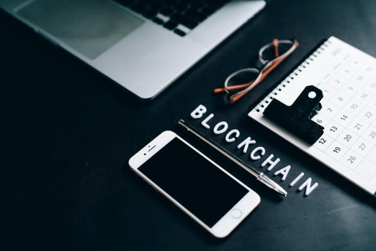smartphone pen calendar and eyeglasses on flat surface Blockchain